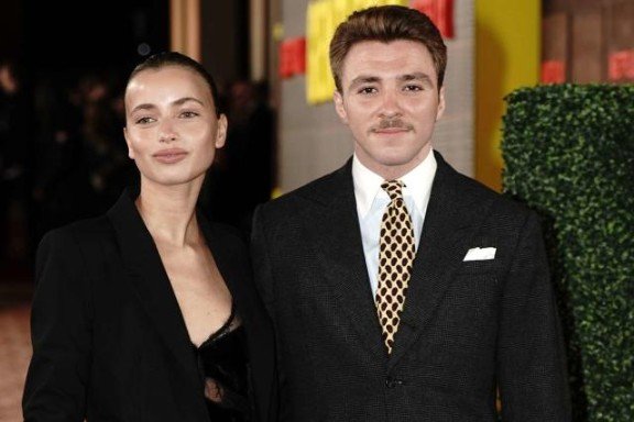 Madonna and Guy Ritchie’s son, Rocco Ritchie, made a stylish appearance with his girlfriend, Olivia Monjardin, at a red carpet premiere, showcasing their fashionable presence